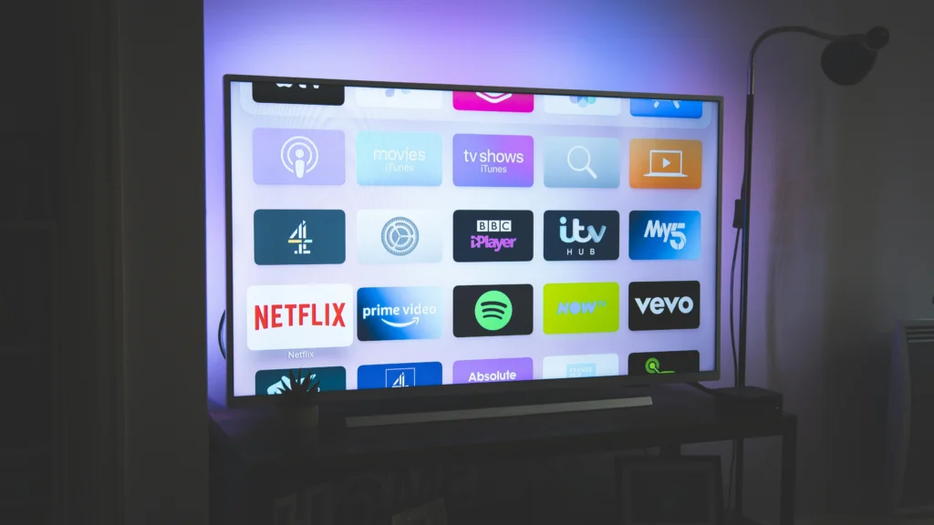 Smart TV home screen showing various IPTV apps with colorful icons.